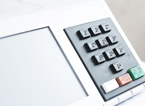 White ballot box with black, white, red and green buttons