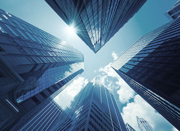 Lower view of a mirrored set of buildings